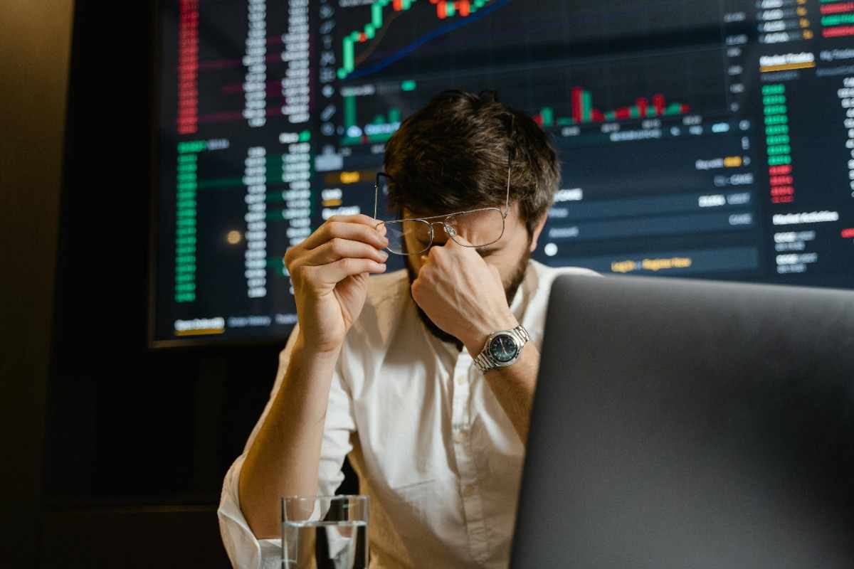 Person looking concerned while checking crypto wallet on a phone